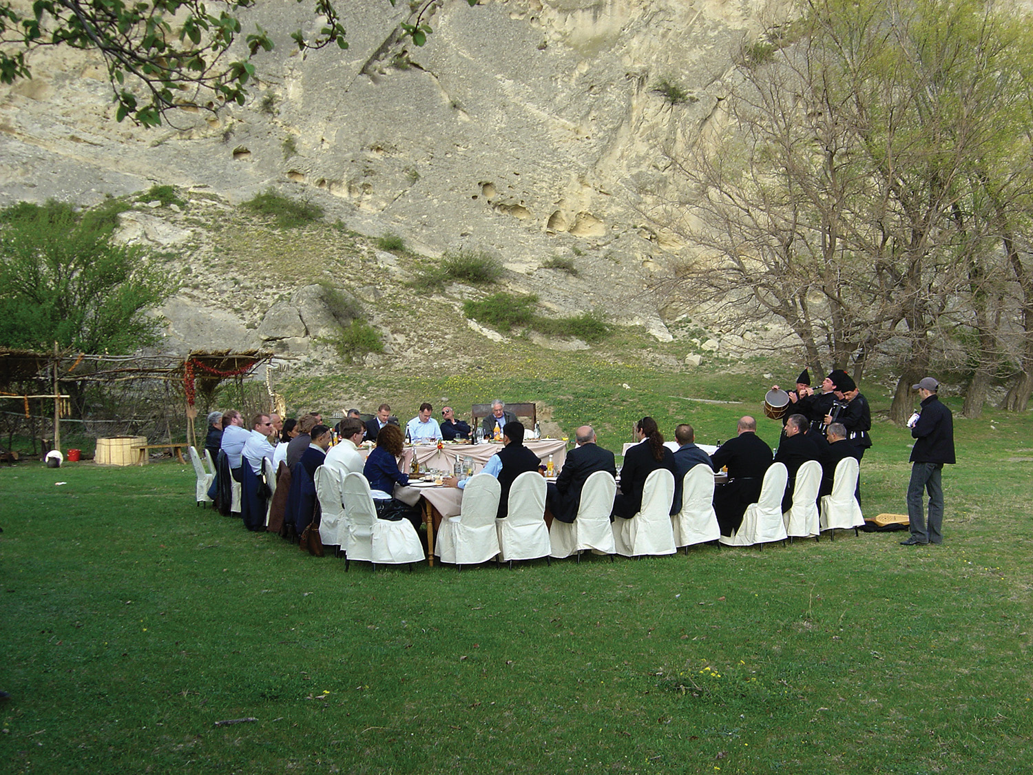 Elegant white event tents on a green lawn, produced by Georgian Events